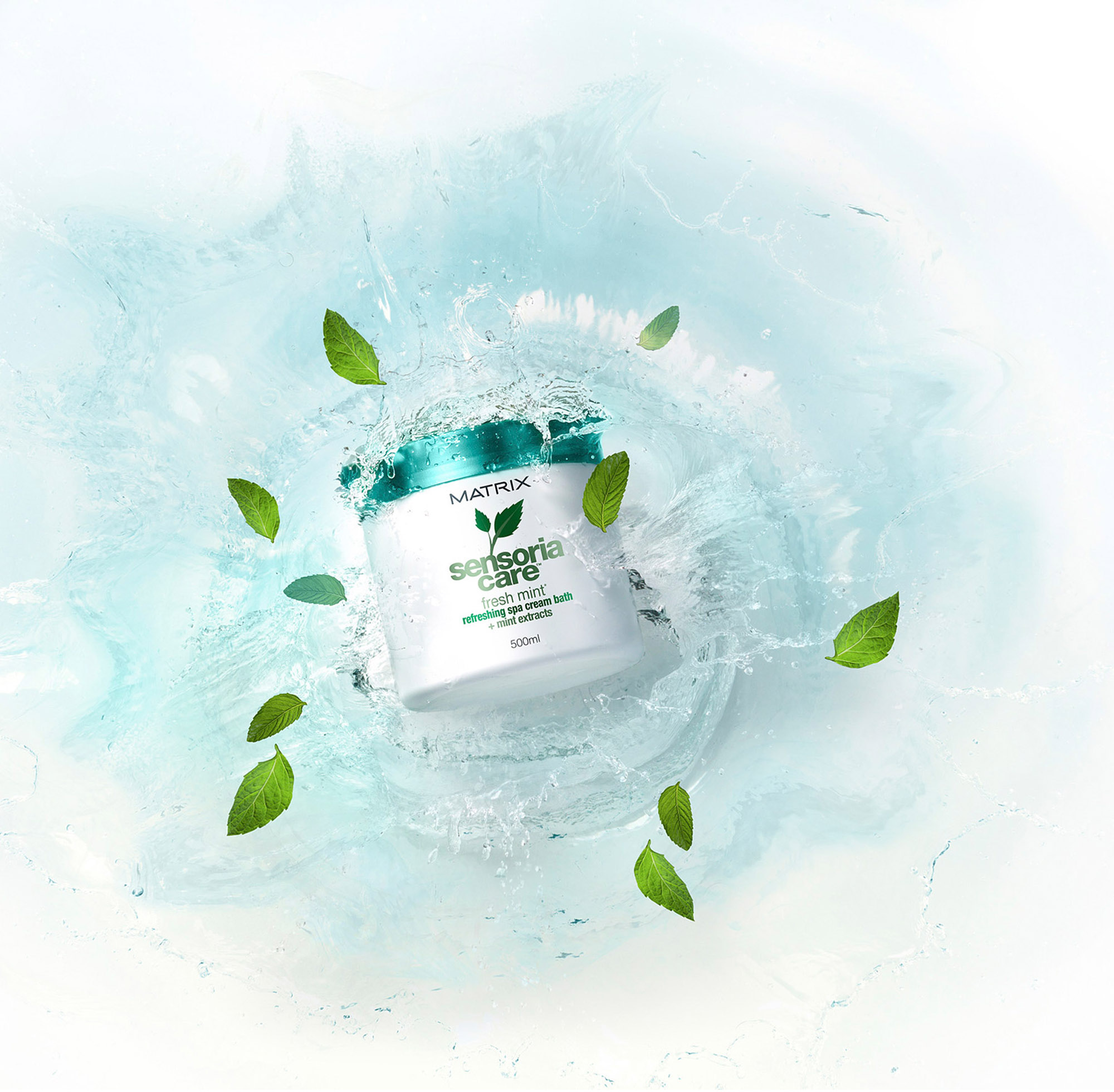Commercial cosmetics photography services Advertising image featuring Matrix Sensoria Care with a water splash and mint, part of a commercial cosmetics photography campaign.