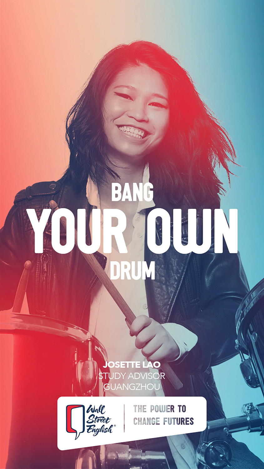 Commercial lifestyle photography services. A young and energetic model enjoying a drum set in a playful moment, captured during a commercial lifestyle photography campaign for Wall Street English.