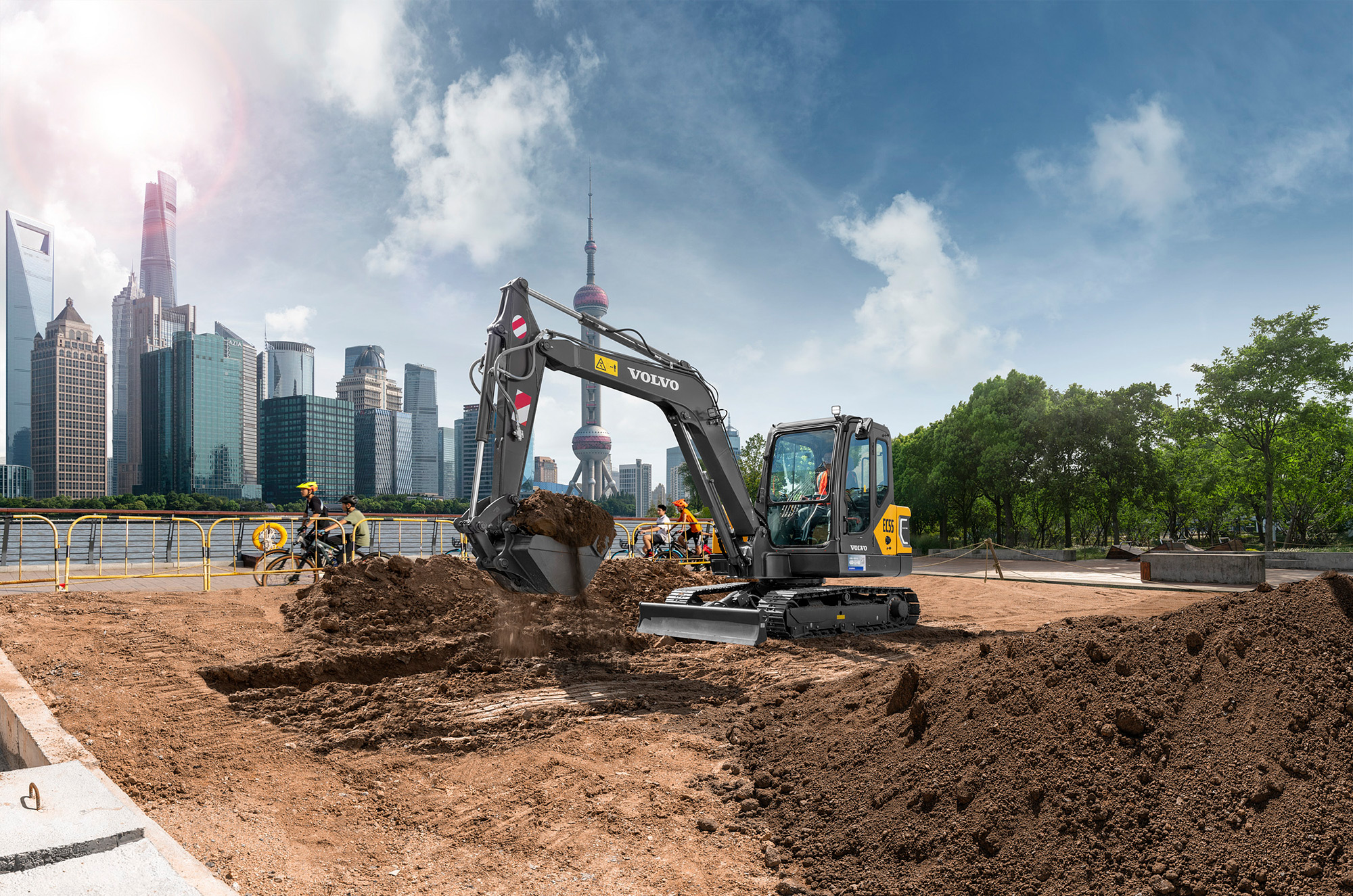 Construction equipment photography services A small electric excavator works quietly in a park, captured for a construction equipment photography campaign.