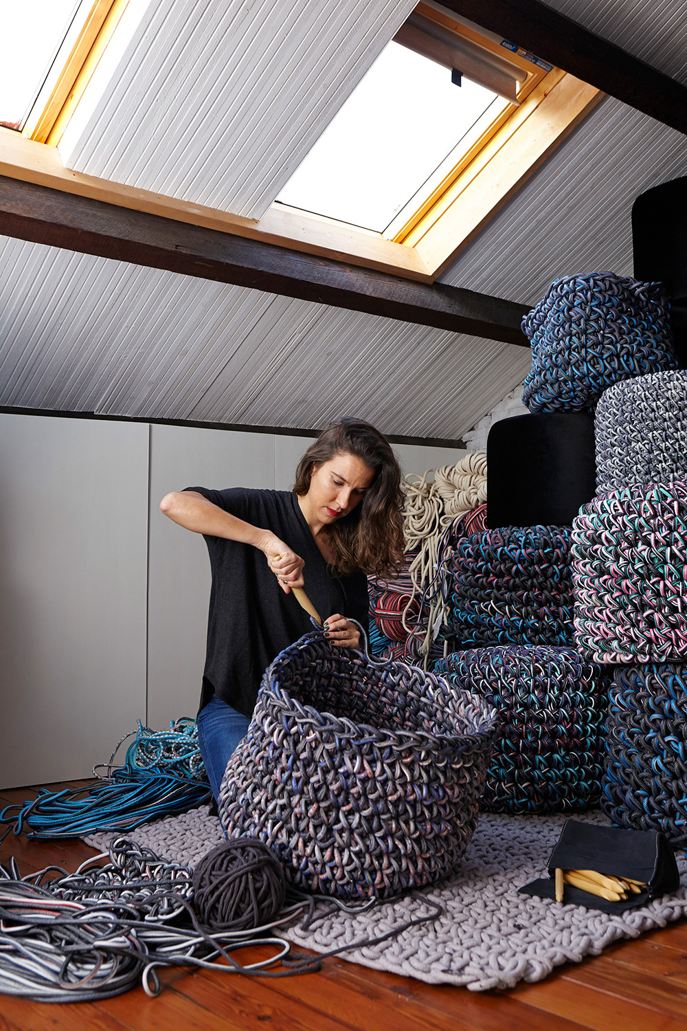 Corporate Portrait Photography Services The Spanish artist at work with large crochet pouf creations, captured as part of our corporate portrait photography services.