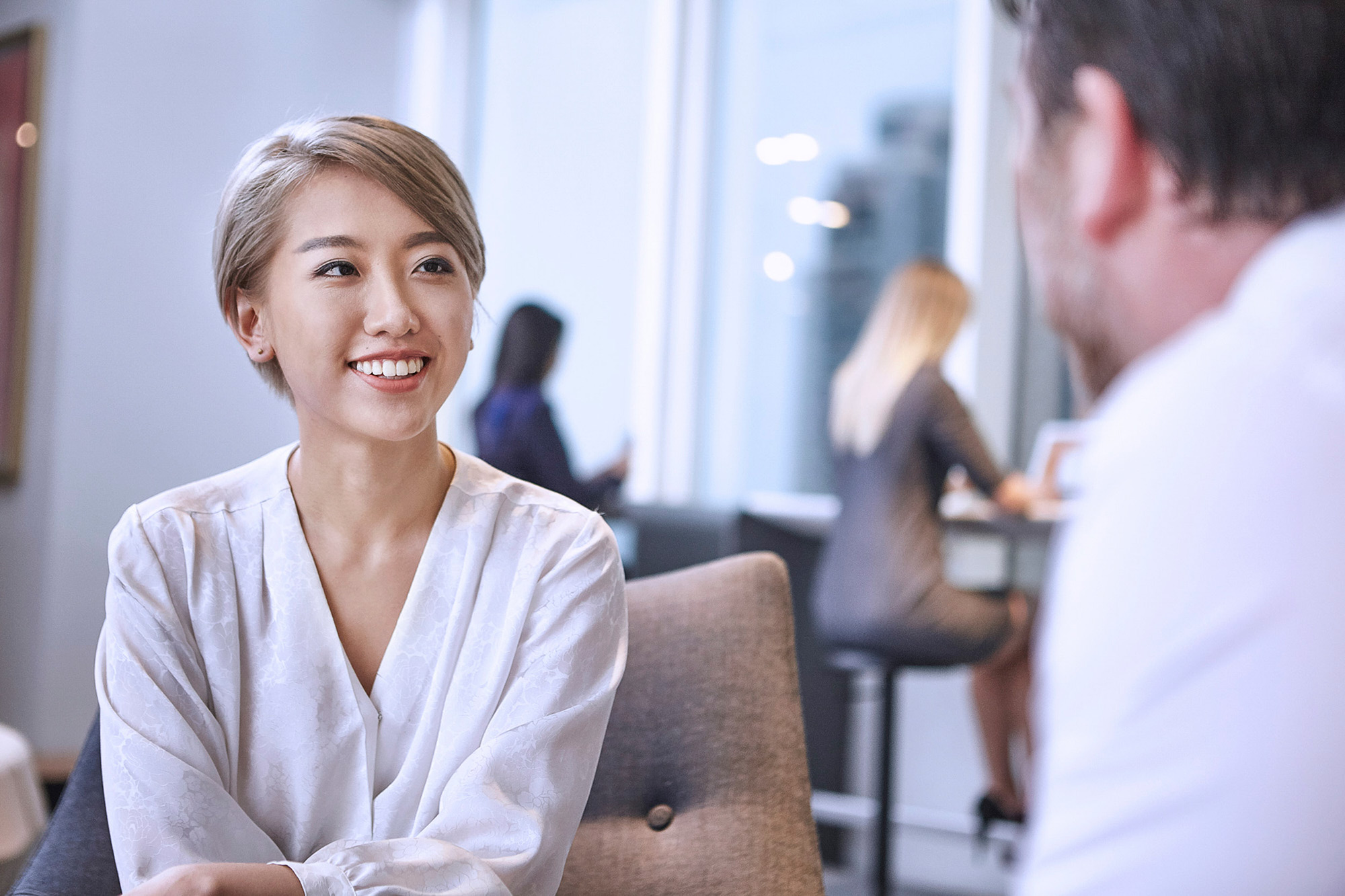 Corporate Photography Services. As part of a corporate photography campaign, a business meeting is captured taking place inside the offices of Haworth's HQ.