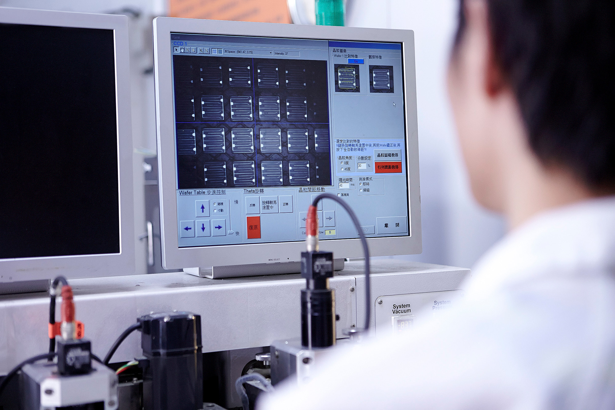 High-tech Science Photography Services A lab technician analyzes LED lighting heads under a super micron microscope as part of a high-tech science photography campaign.