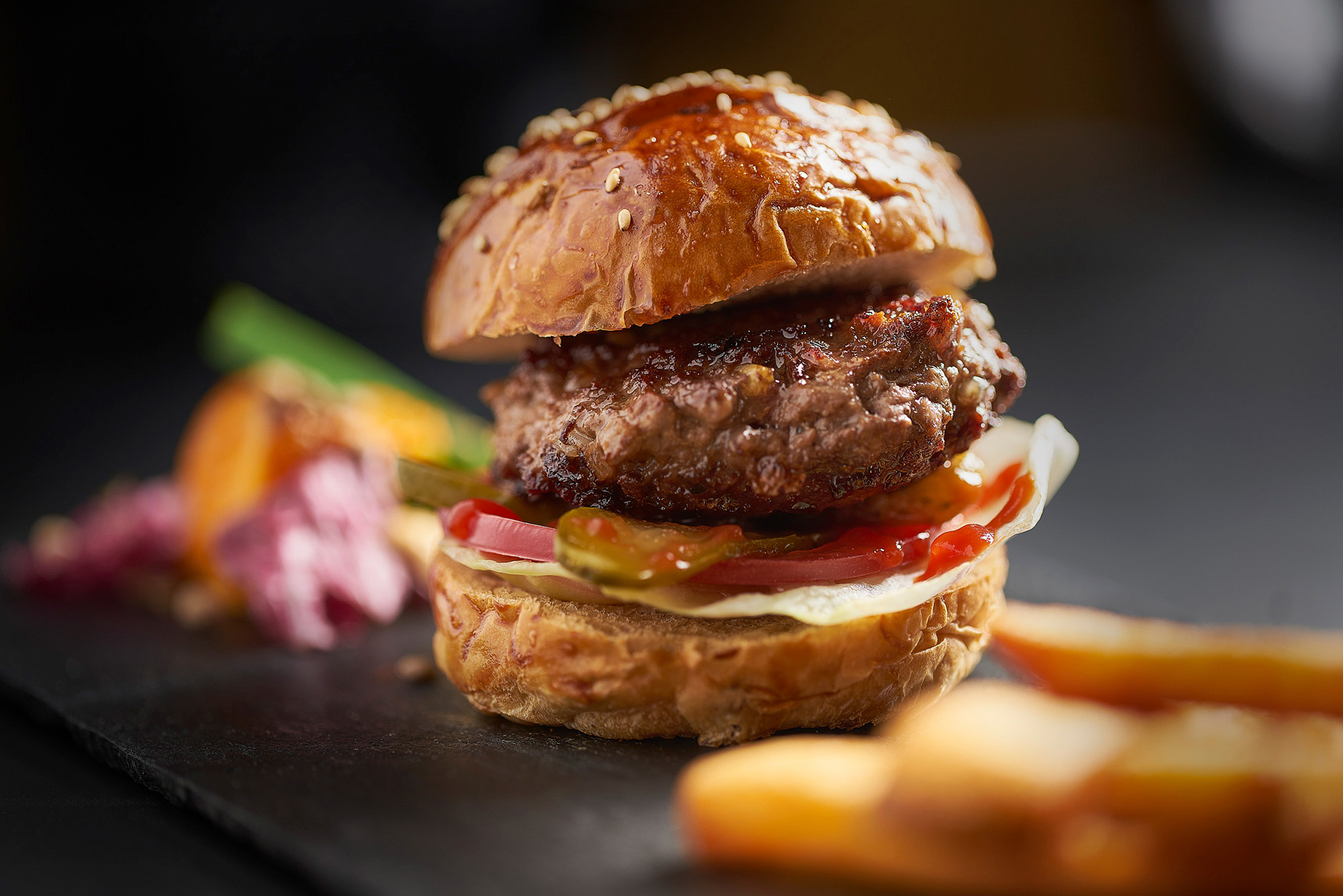 Hotel and hospitality food photography services Macro photo showcasing a delectable hamburger from Silver Fern Farms, featured in a hotel and hospitality food photography campaign.
