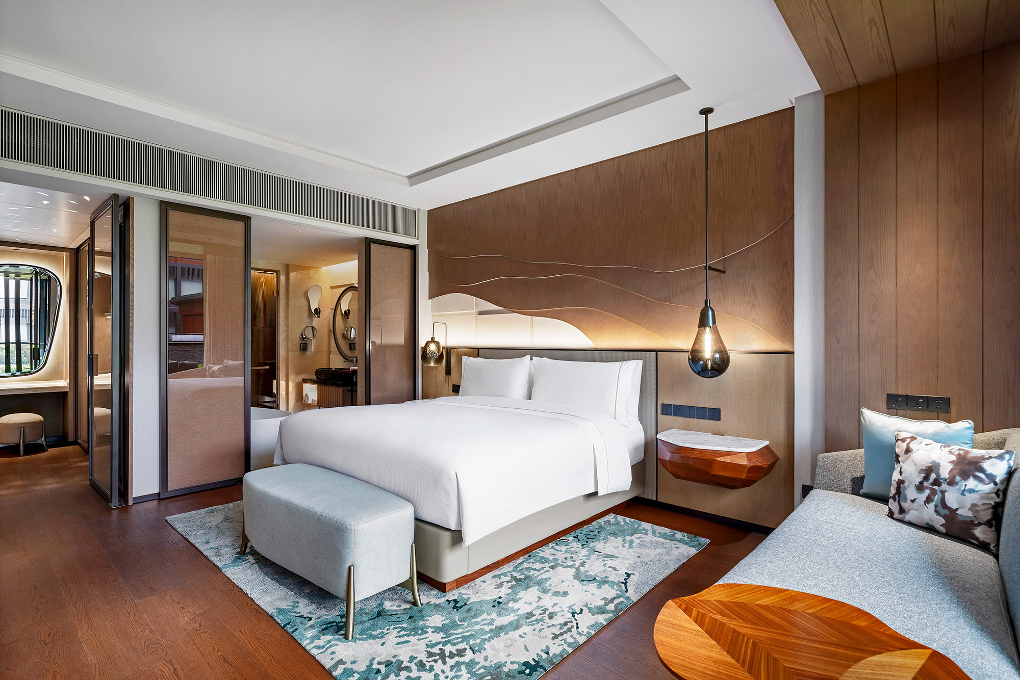 Hotel and hospitality interior photography services Interior image of a hotel master bedroom suite, captured as part of a hotel and hospitality interior photography campaign.