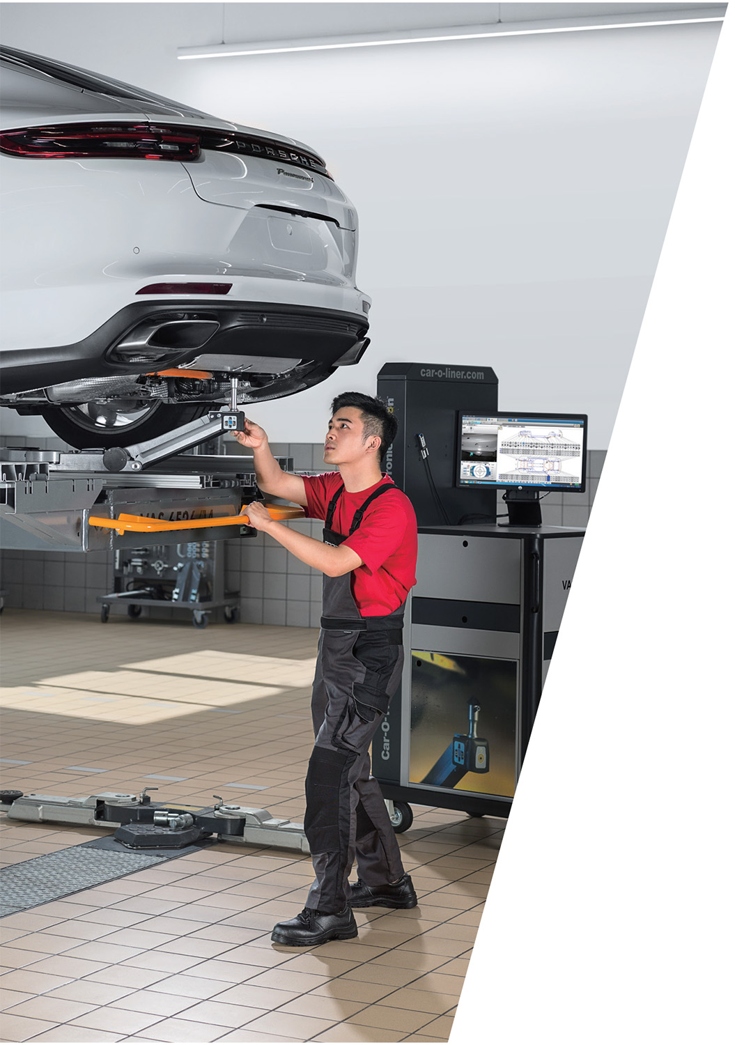 Industrial Mechanical Photography Services Porsche professional mechanic servicing a Panamera, captured for an industrial mechanical photography campaign.