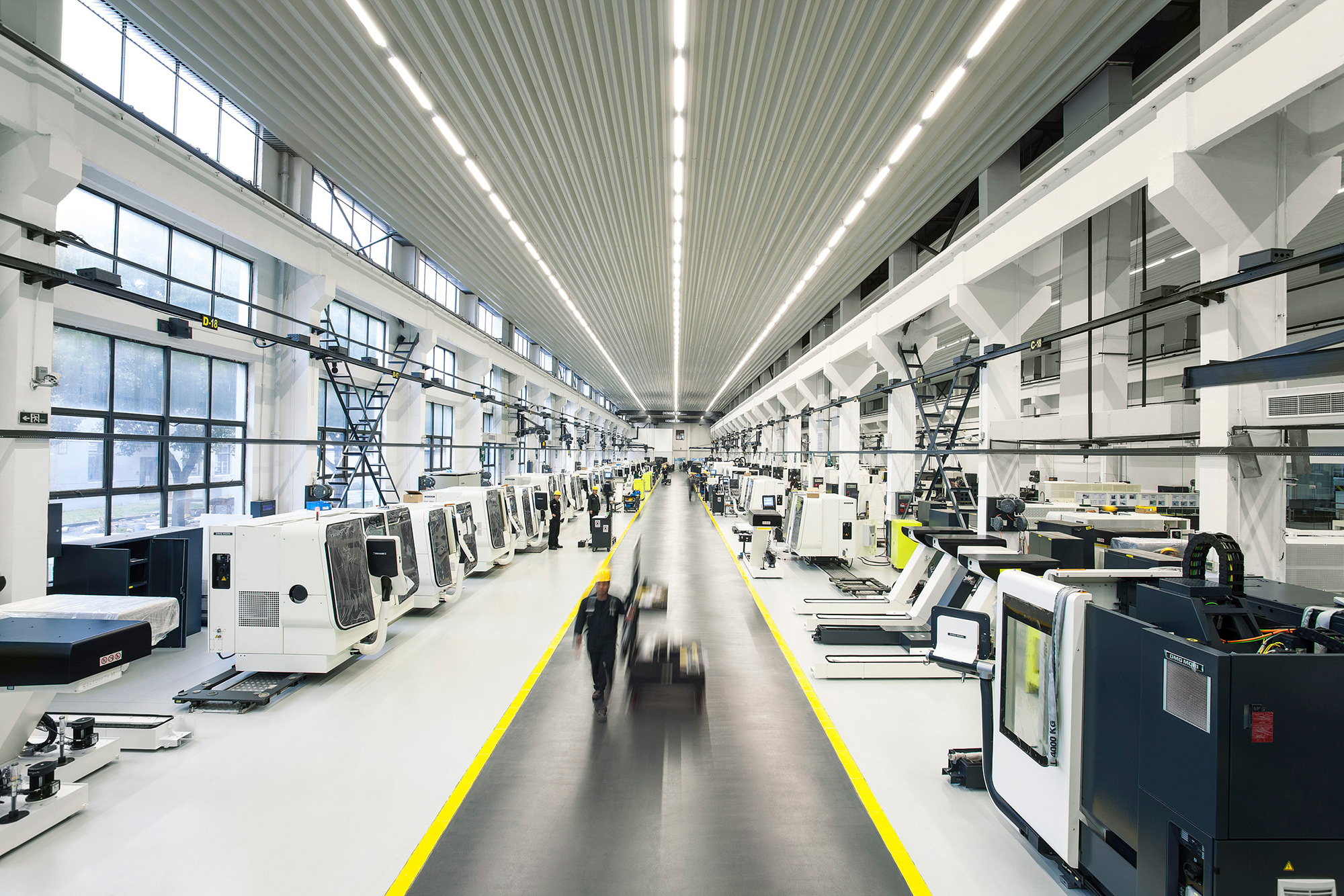 Industrial Mechanical Photography Services. Production floor of DMG Mori showcasing an array of turning and milling machinery, captured for an industrial mechanical photography campaign.