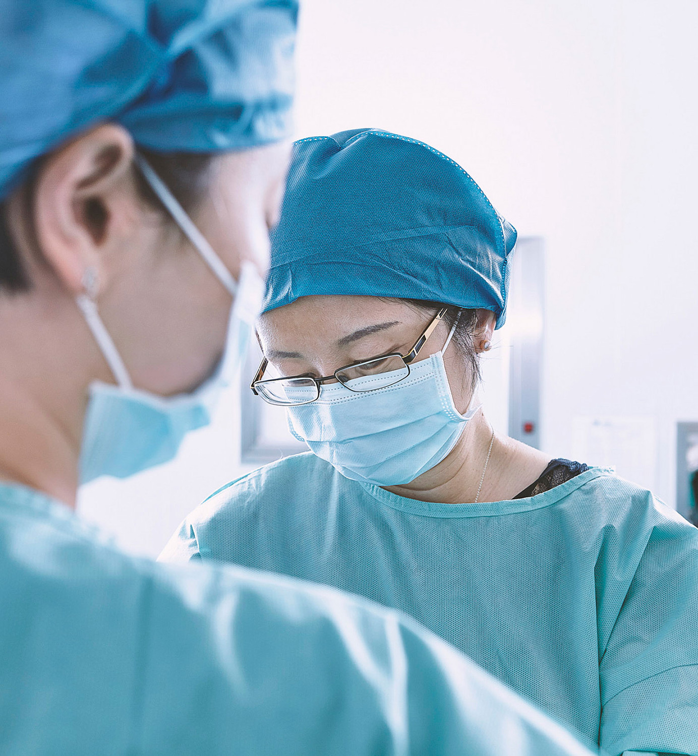 Medical Science Photography Services Two doctors focused on their patient inside an operating room as part of Medical Science Photography Services.