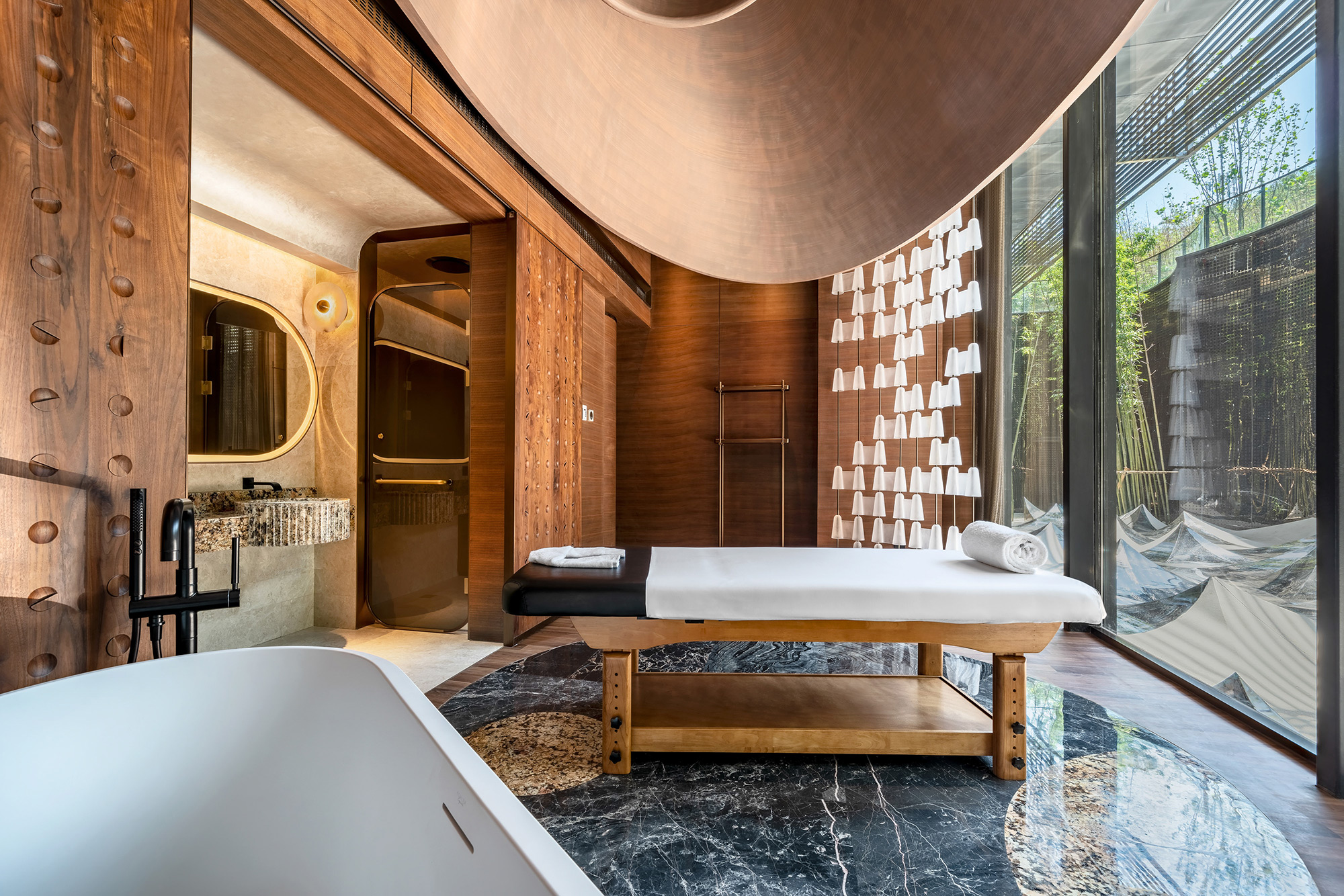 PhilippeRoy_archi_1925 Serene and calming interior of a spa massage room at Marriott Hotel, showcasing the luxury and relaxation ambiance for guests.