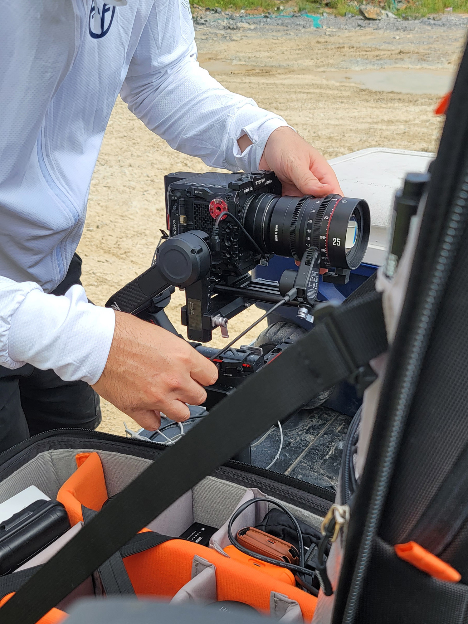 Videographer adjusting lens during Volvo commercial video production shoot