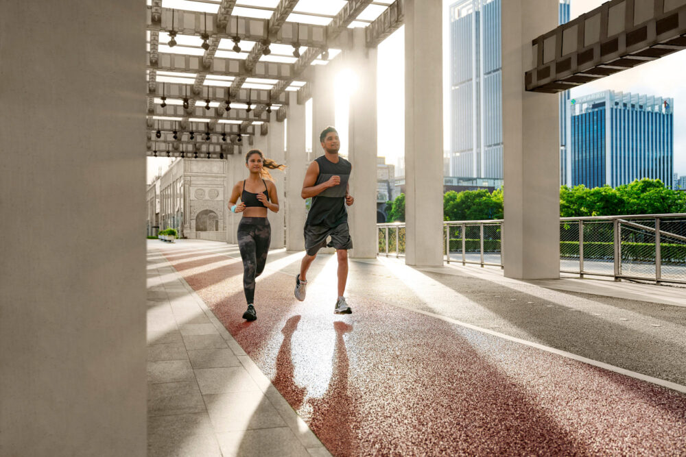 Runners in athletic apparel jogging alongside a river in a lifestyle commercial and advertising photography image produced for Westin.