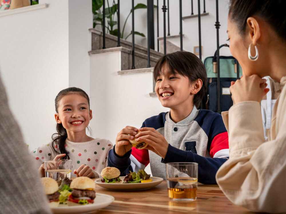 Family enjoying dinner together for a commercial advertising shoot.