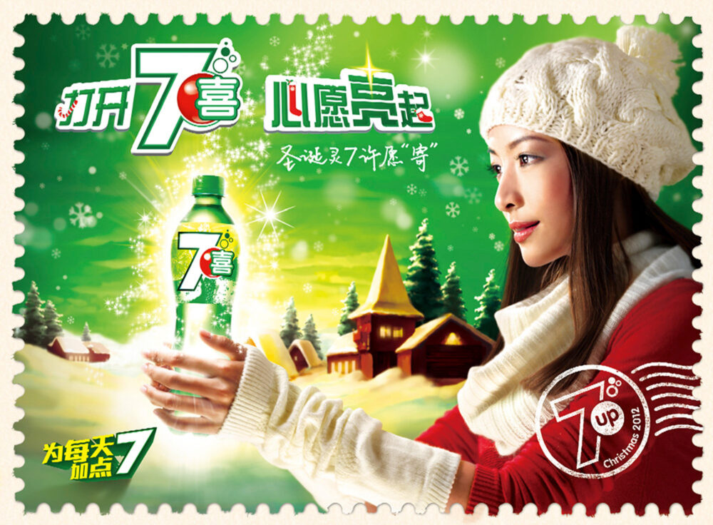 Woman in a festive sweater and hat, amidst a snowy backdrop, holding a bottle of 7 Up for a Christmas commercial lifestyle photography campaign.