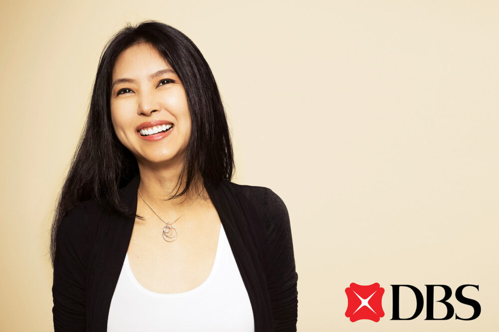 Smiling woman featured in a DBS Bank commercial lifestyle photography campaign for advertising and marketing purposes.