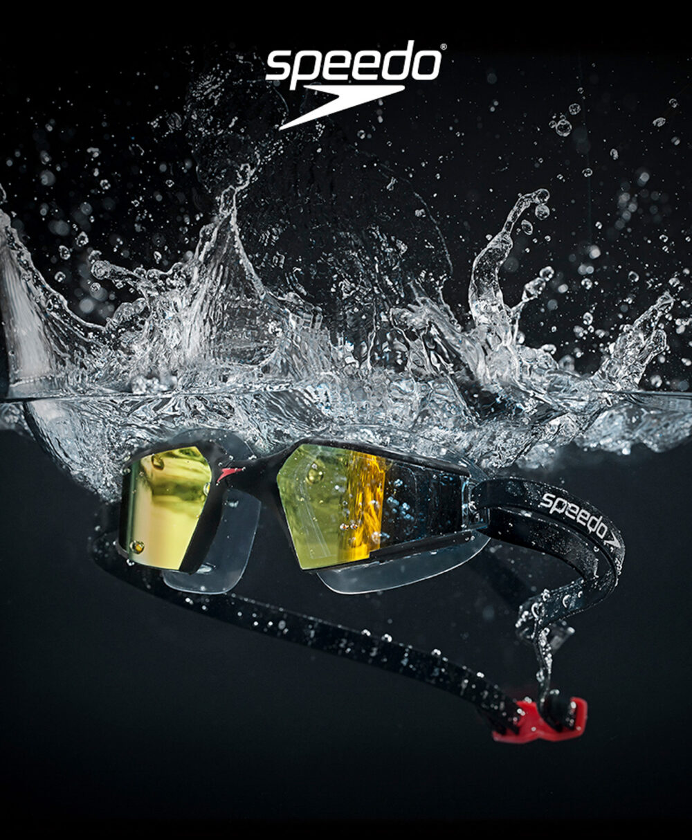 Product photography of Speedo swim goggles splashing into water for a commercial and advertising campaign.