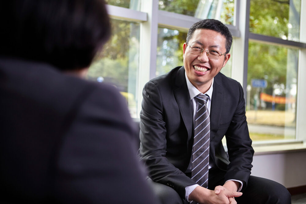 Upper management team meeting at CarsGen, taken for corporate photography emphasizing teamwork.