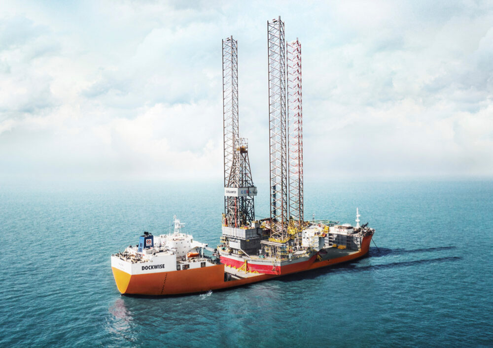 Hero image of the Treasure vessel with an oil rig, captured for Dockwise's naval industrial photography.