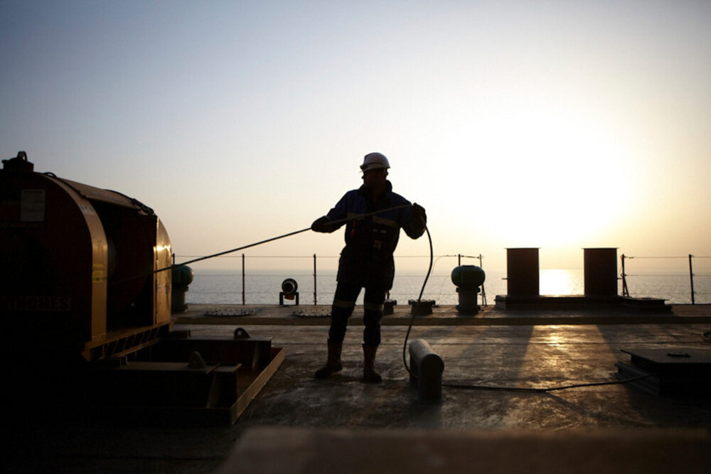 Naval engineer at work on a dock, part of Dockwise's naval industrial photography.