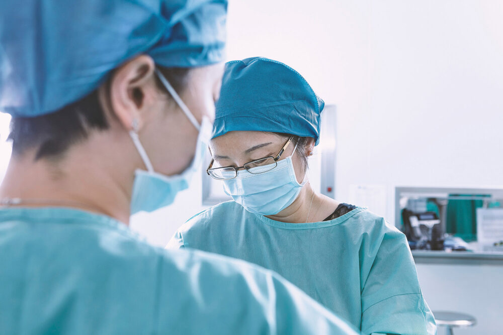 Team of female doctors in the operating theater at Ferguson Women's Health, captured for a medical science photography project.