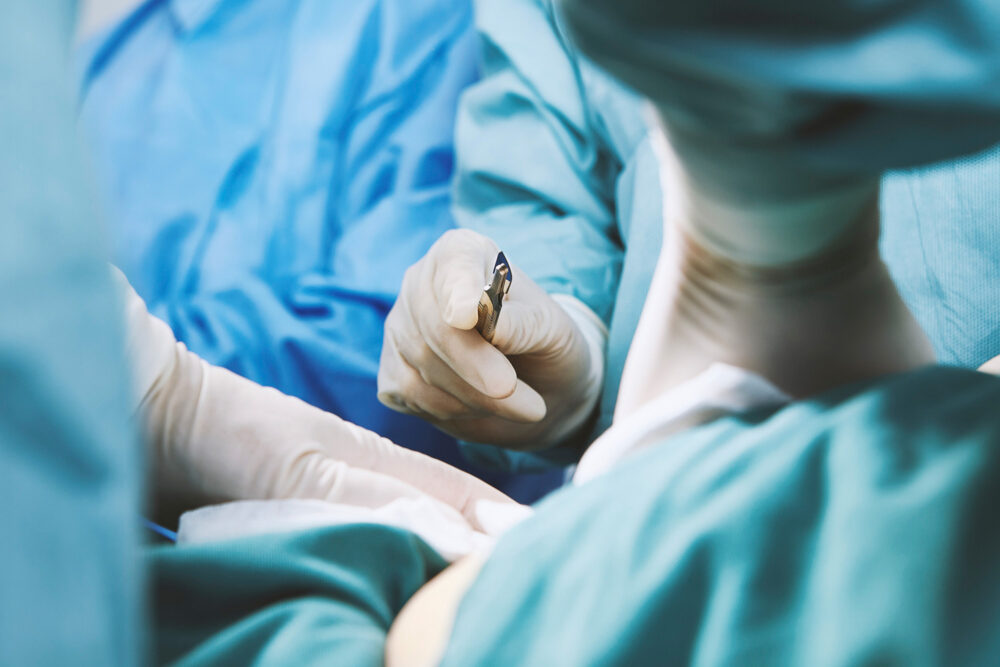 Team of female doctors in the operating theater at Ferguson Women's Health, photographed for a medical science campaign.