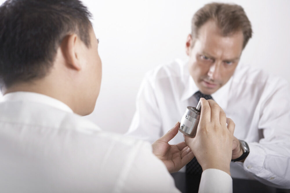 Engineering management team in session at Image Source, photographed for corporate documentation.