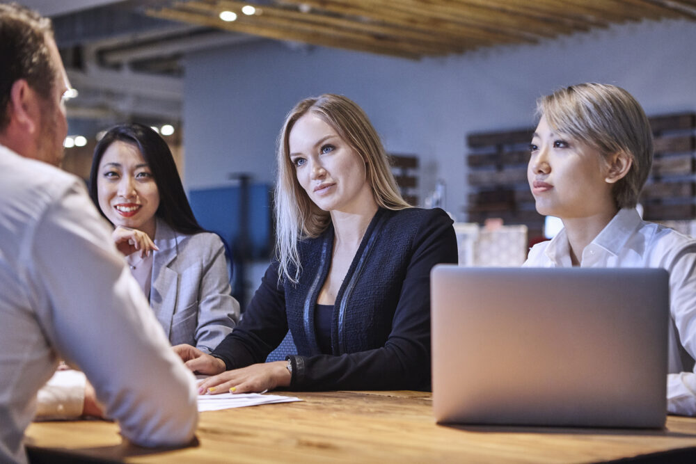 Corporate business management team in discussion at Image Source, captured for a corporate photography session.