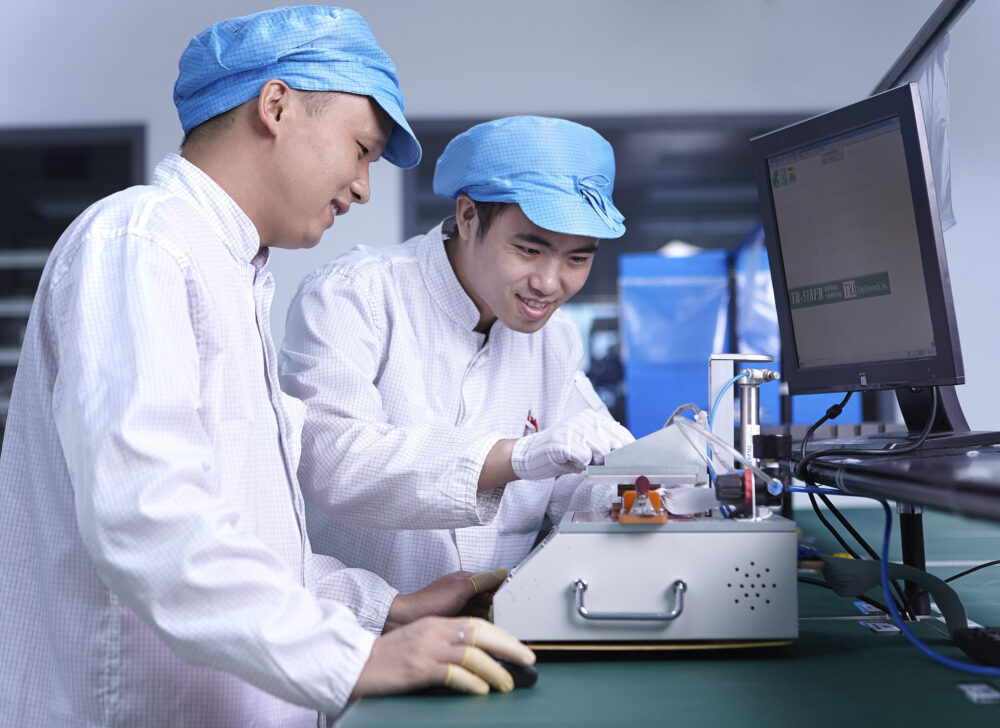 Two engineers collaborating in a science and technology image produced for Flextronics.